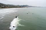 Overview of Surfers catcing the waves at Cayucos State Beach, California, USA